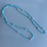 Long blue and White Bead Daisy Necklace slide over Long Blue Necklace