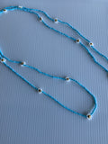 Long blue and White Bead Daisy Necklace slide over Long Blue Necklace