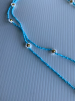 Long blue and White Bead Daisy Necklace slide over Long Blue Necklace